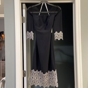 Kay Unger black dress with illusion neckline and silver embroidery trim.